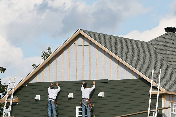 Professional Siding Installation technician working in Naples, FL